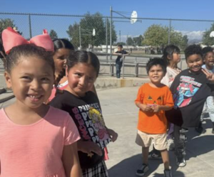 6 students in selfie at playground