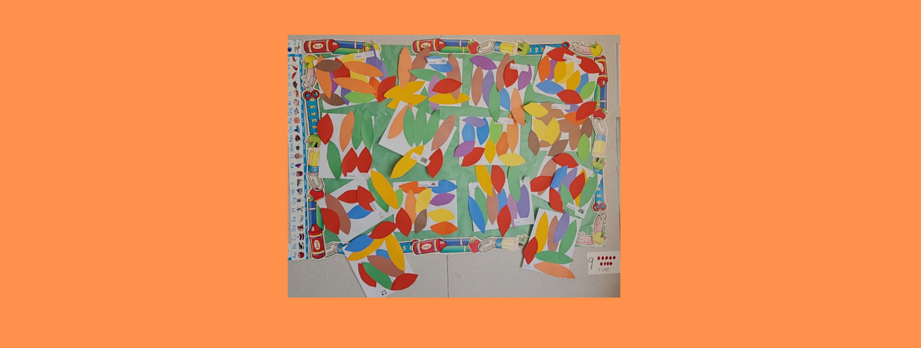 A colorful collage made up of various shaped paper pieces arranged on a pastel background.
