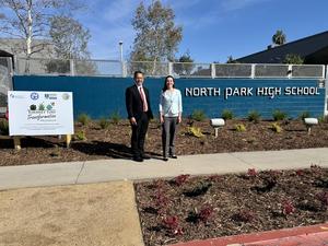Dr. Mendoza and Jennifer Santana take a photo at North Park High's updated lawn.
