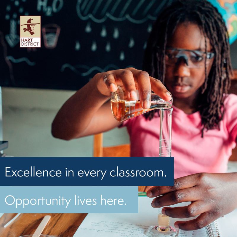 A teen girl with dark skin and hair wearing safety glasses pouring solution into a beaker with the text "Excellence in every classroom. Opportunity lives here."