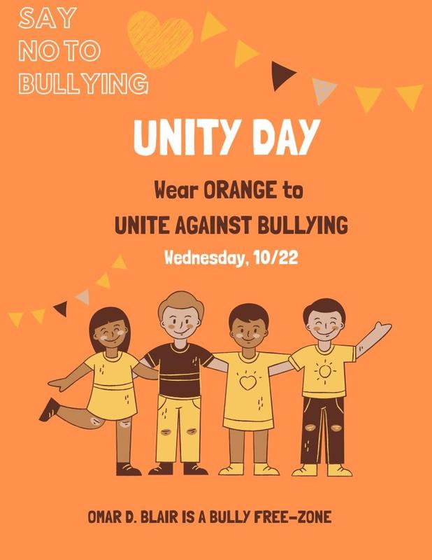Four diverse children wearing orange t-shirts with a message for Unity Day against bullying.