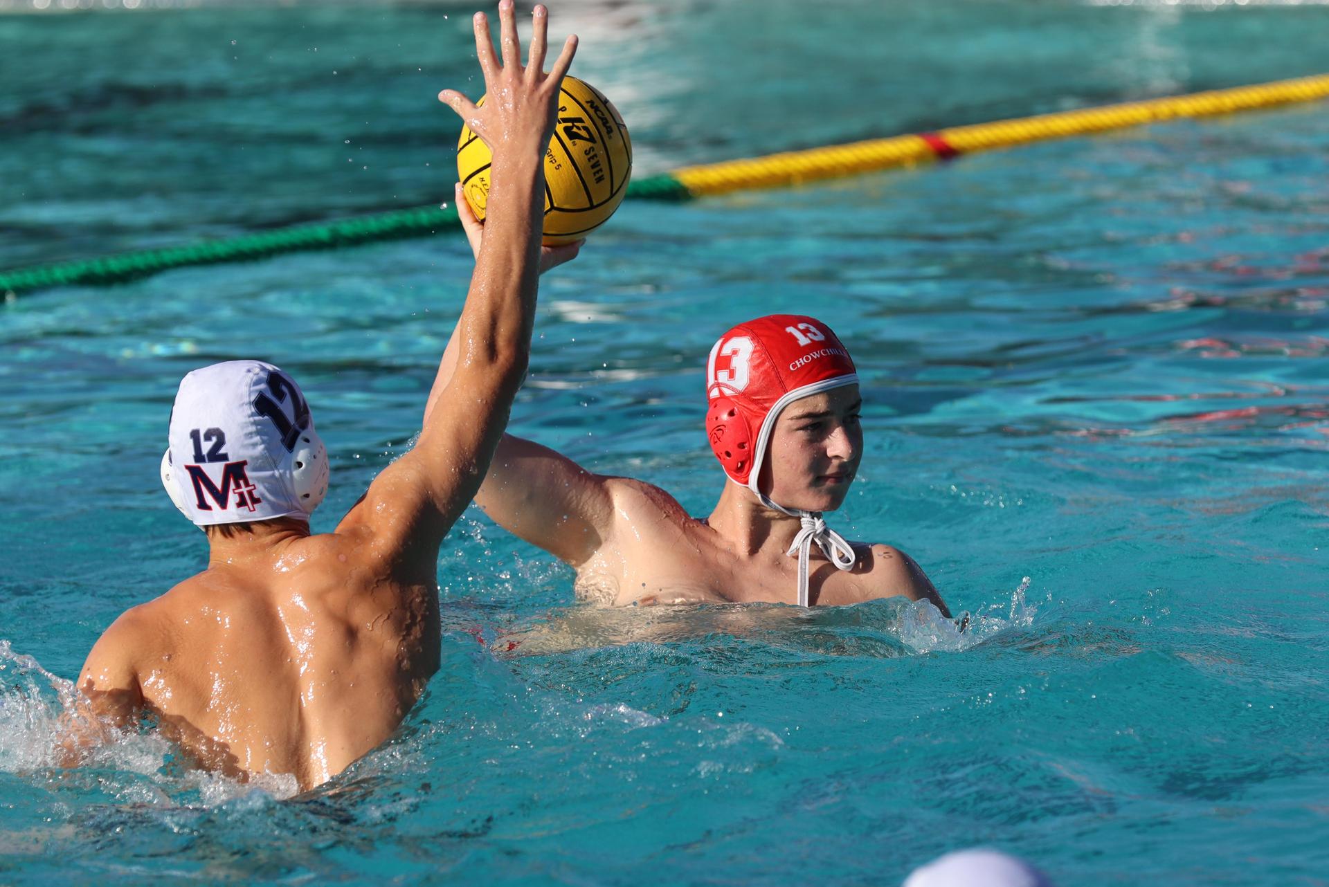 boys water polo players in action against san joaquin memorial