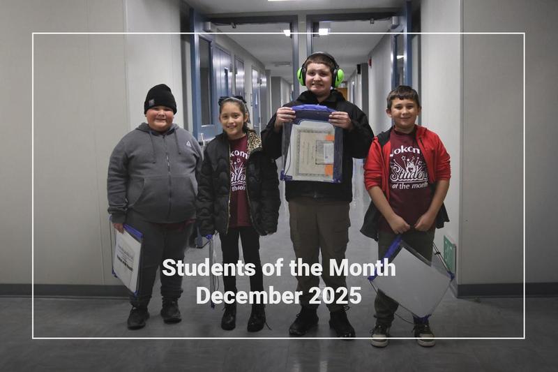 Students holding a bag