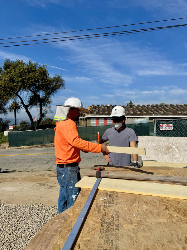 BPACE student preparing to measure and cut wood.
