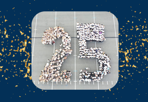 Student of the class of 2025 arranged in the parking lot to form the number 2 and 5.