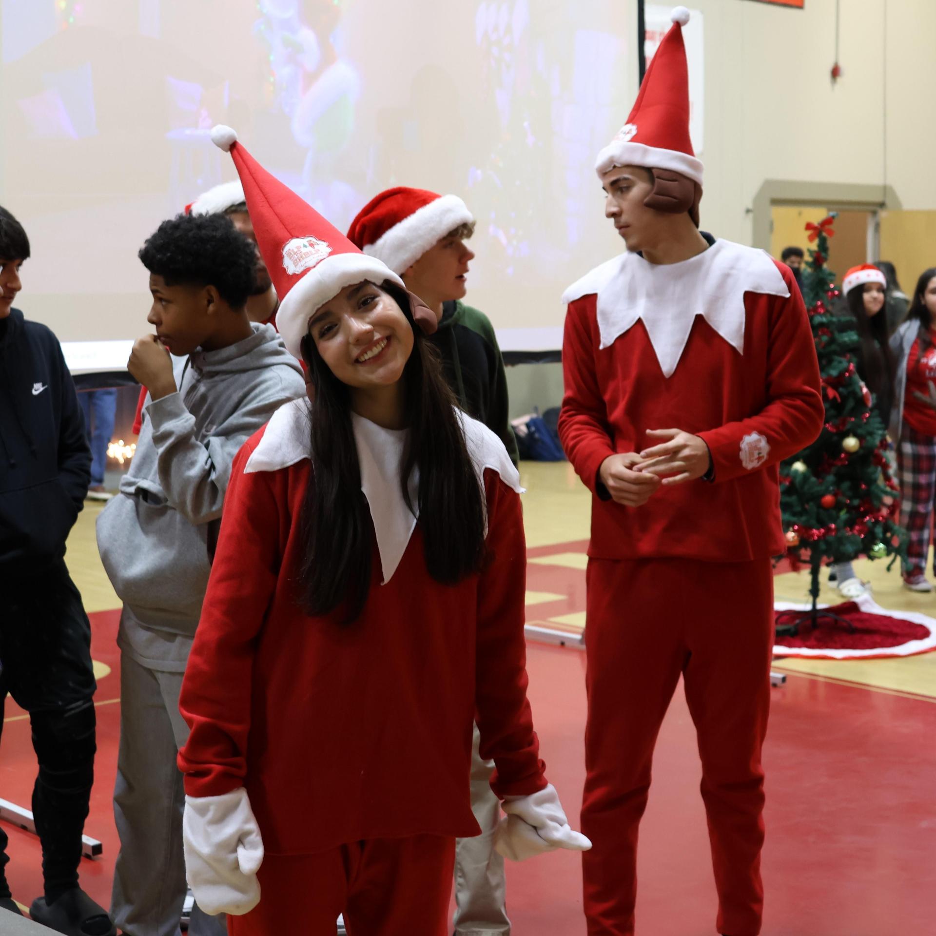 students and staff posing at the winter wishes rally