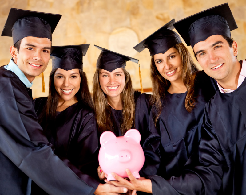 Students in regalia holding a piggy bank