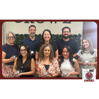 Photo of 8 adults holding awards