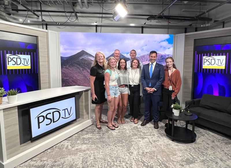 A group of students, teachers, admins and DA Joe Khan in the PSD TV studio