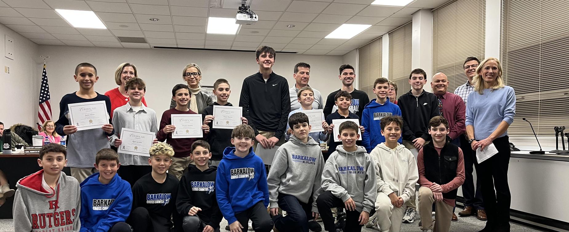 Students accepting sports award