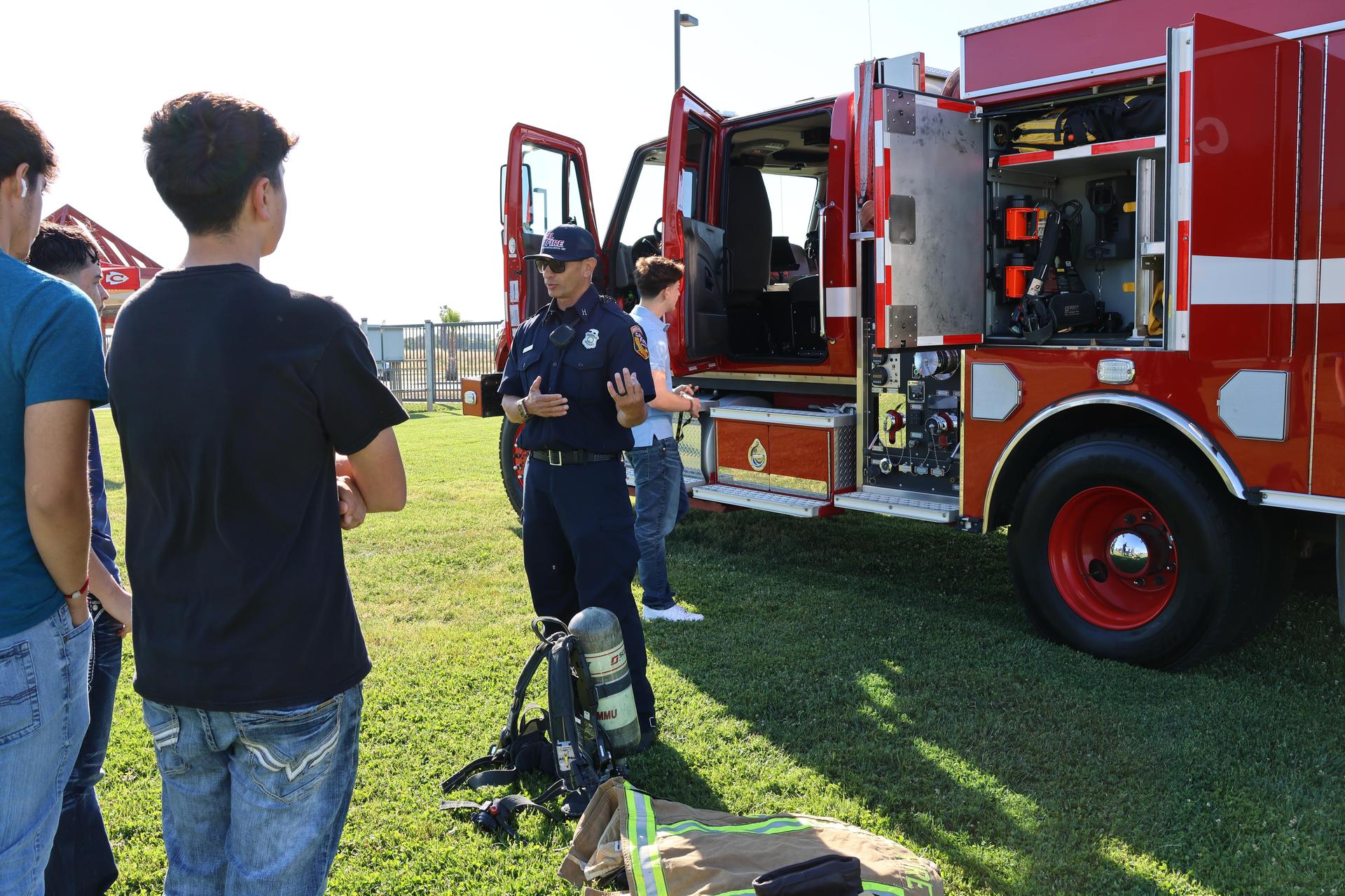 Firefighters speaking to students