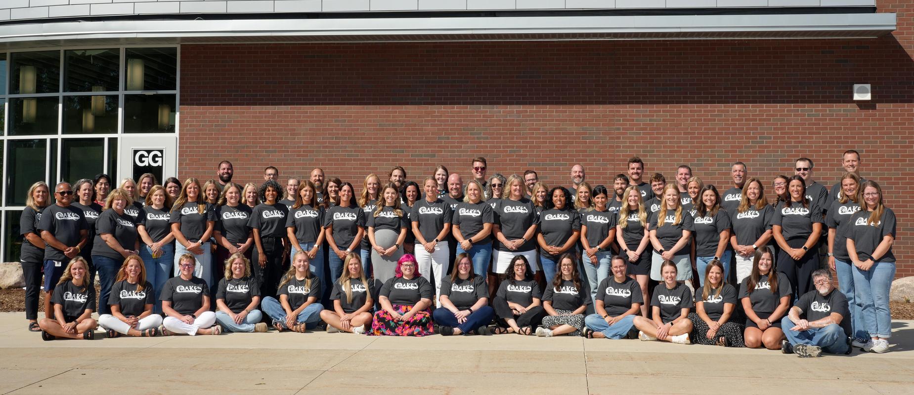 Oakestown 2026-27 staff line up in three rows outside the building