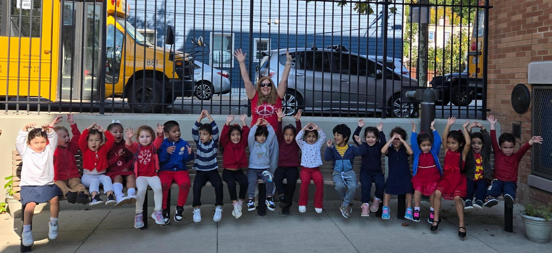 prek students relaxing on the bench