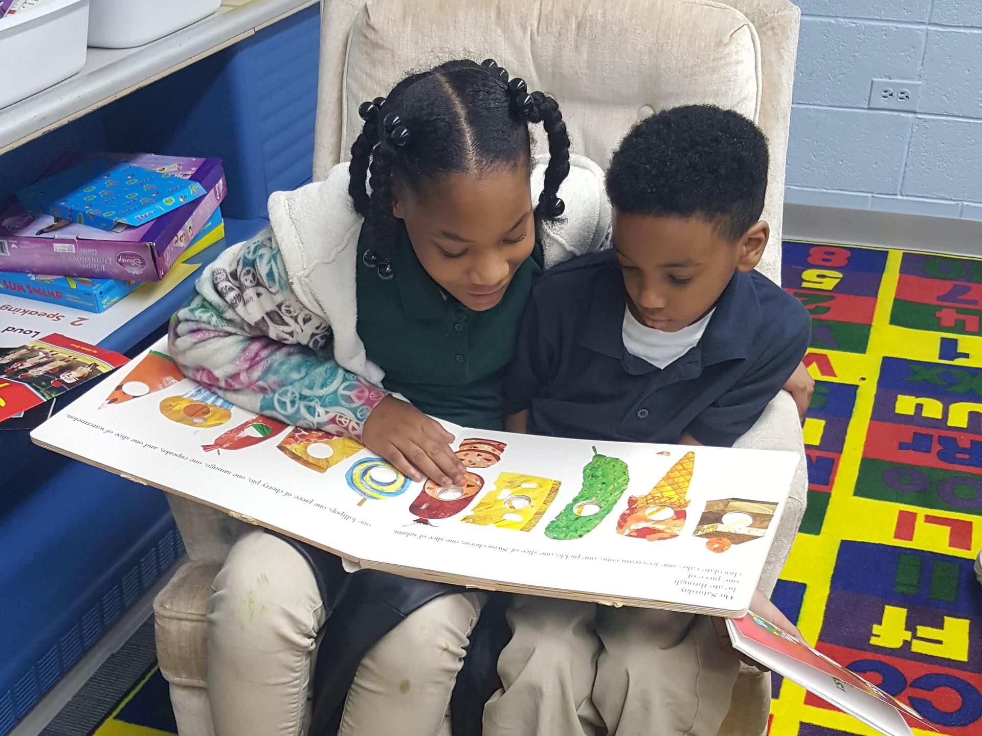 Student helps student with reading