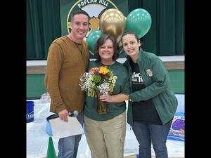 Photo of staff member of the year with admin.