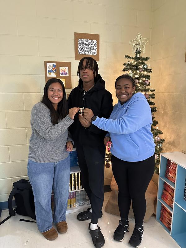 Students showing trophy