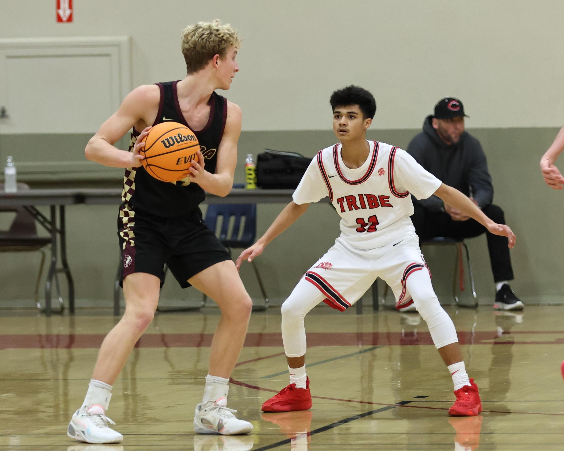 varsity boys basketball playing against sierra