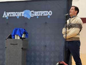 Magician tied up talking.