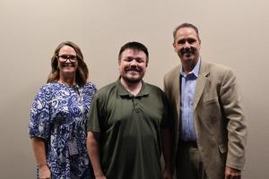 Dr. Brown, Ms. Cholette & Mr. Ritchie pose for a picture after Mr. Ritchie was spotlighted at the September 14 board meeting.