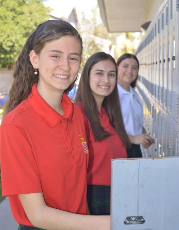 Students standing at locker
