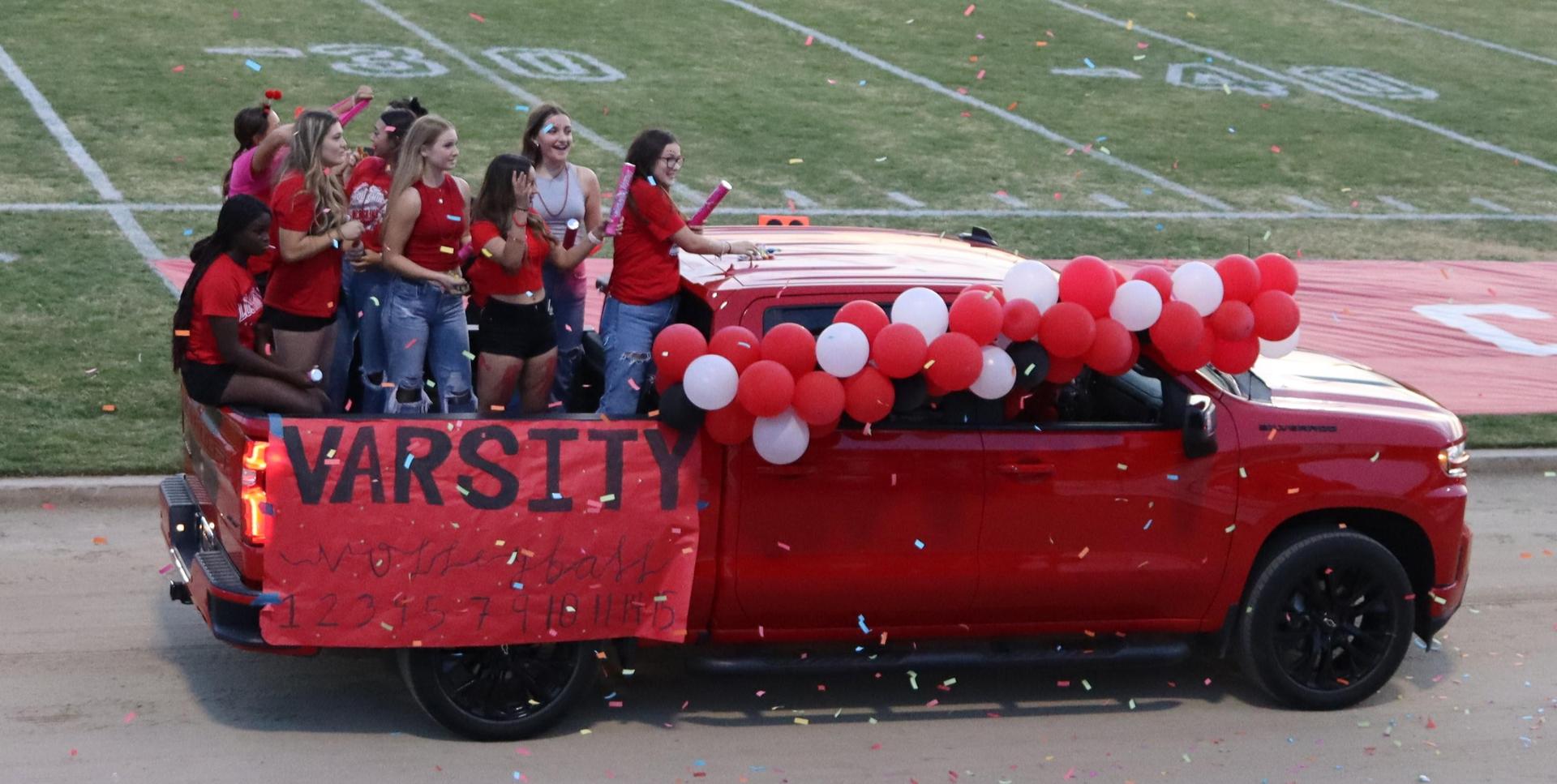 students, staff, and community members enjoying Friday night at the football game