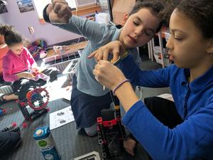 4th grade girls build simple machines.