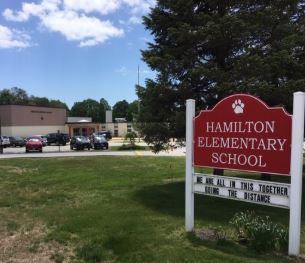 Image of Hamilton School and the front wooden sign on the entrance.