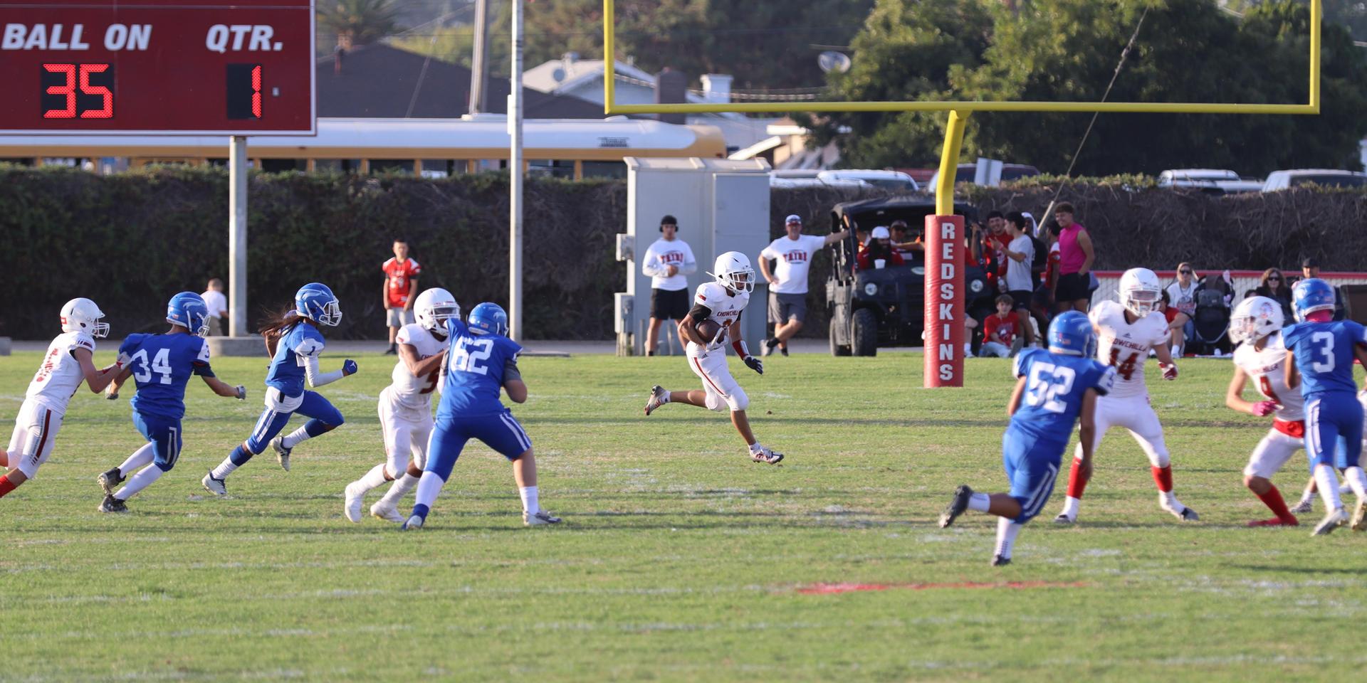 Junior Varsity football players in action against Caruthers