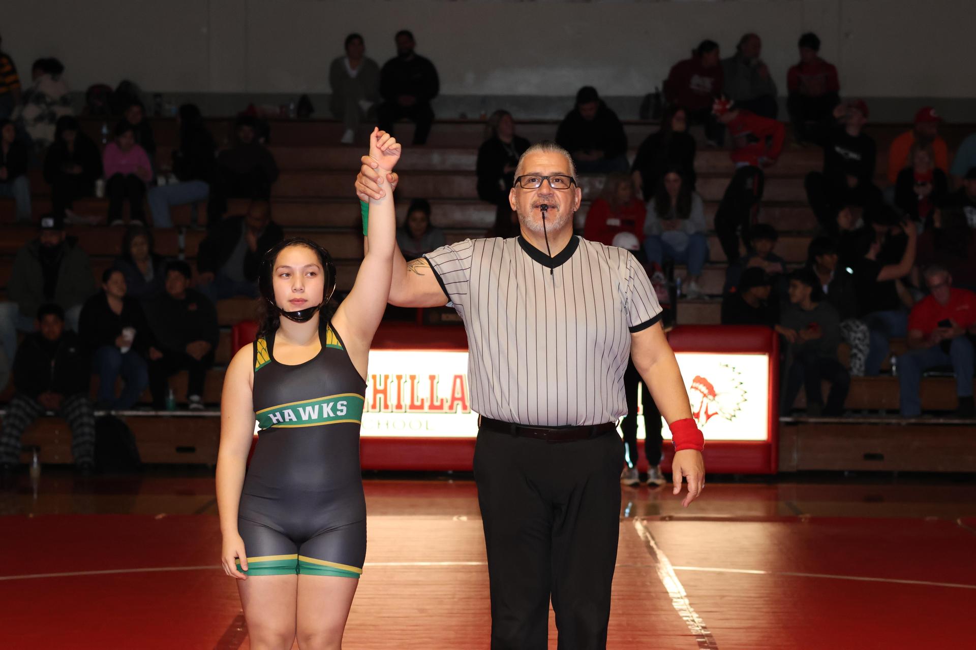 Wrestling winners with hands up 53
