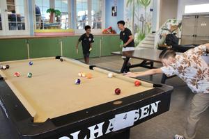 Students shooting pool