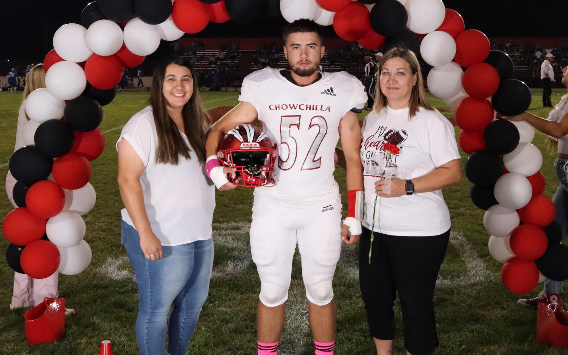 seniors and their escorts celebrating senior night