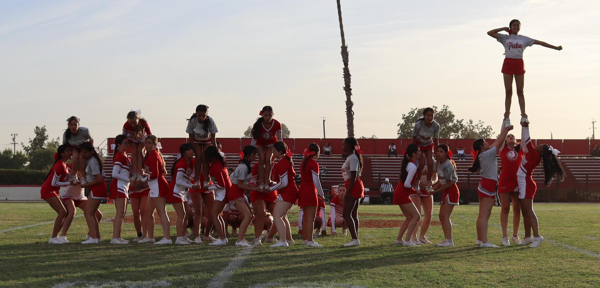 Combined cheer performing at halftime of the football game