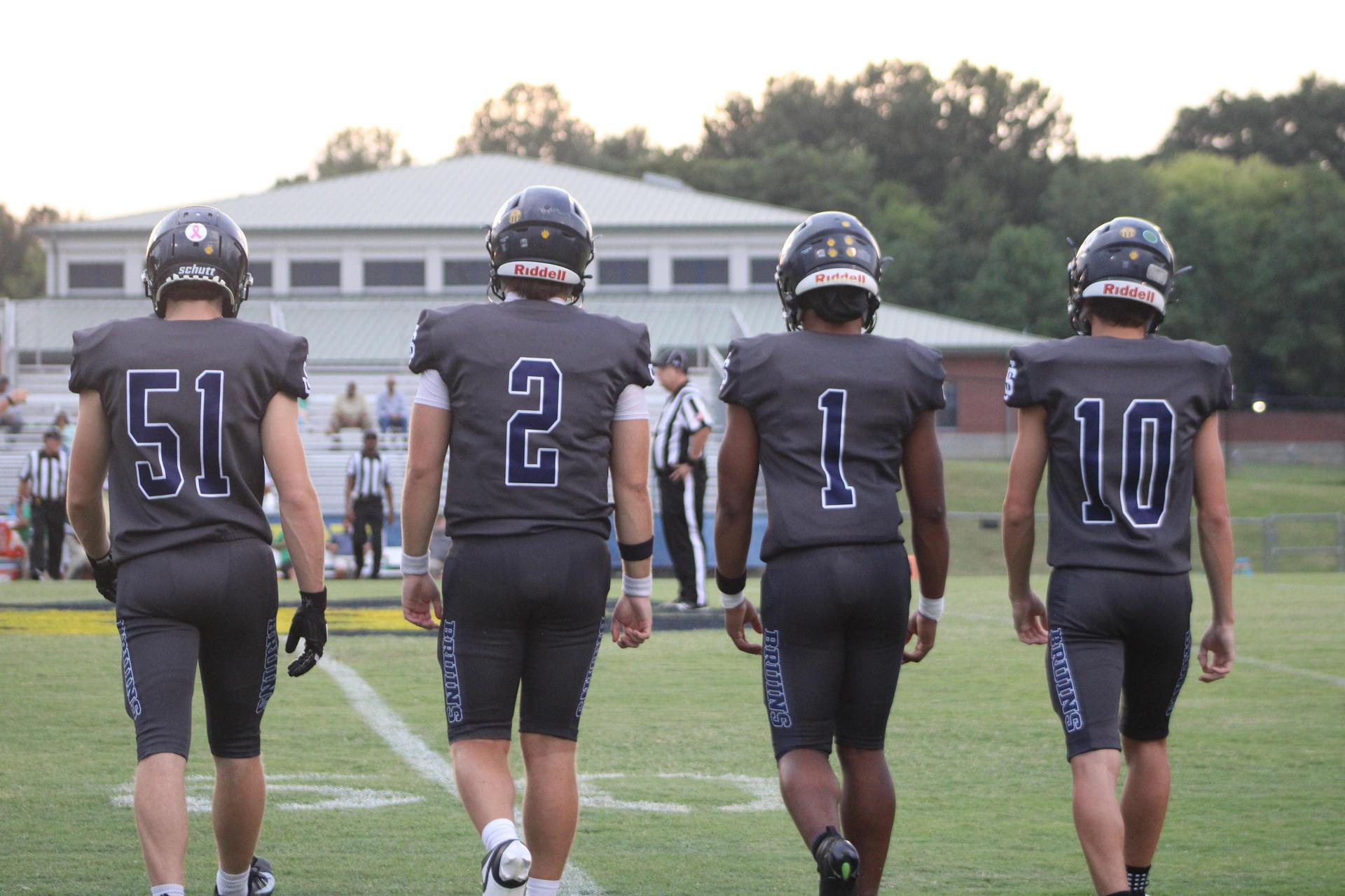 Football players walking on the field