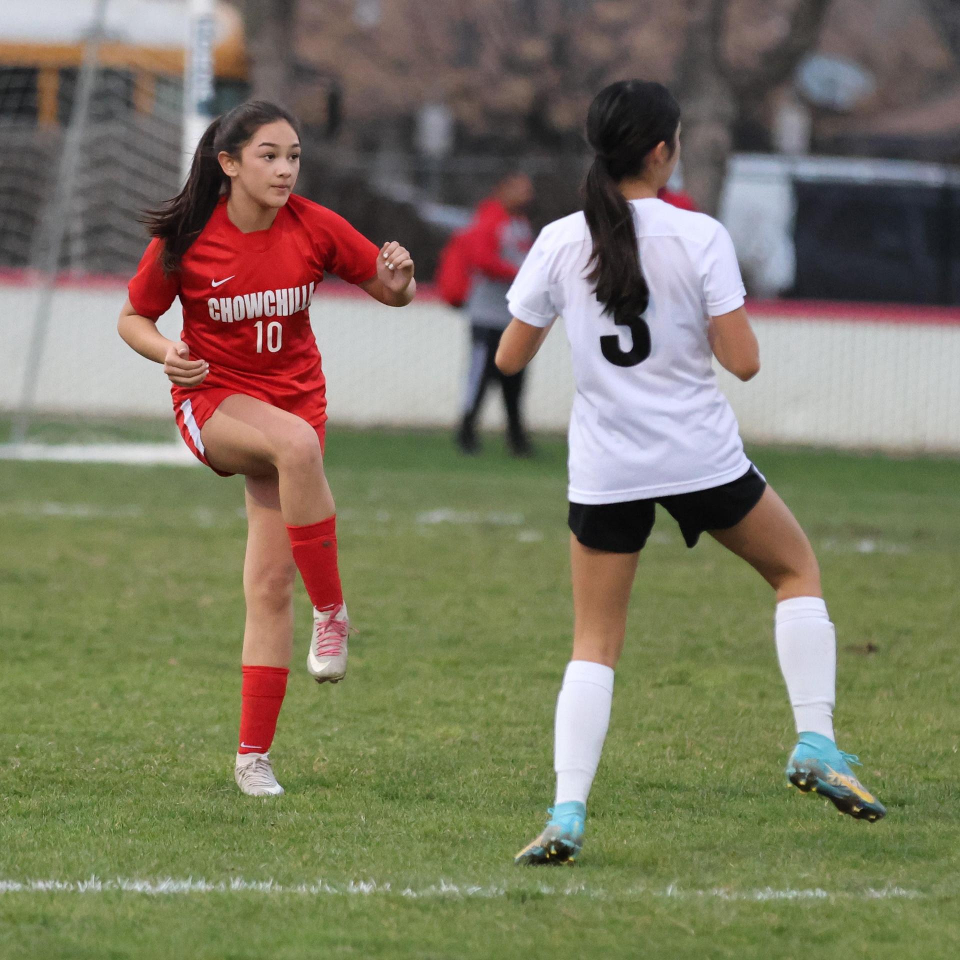 Junior varsity girls playing soccer against liberty