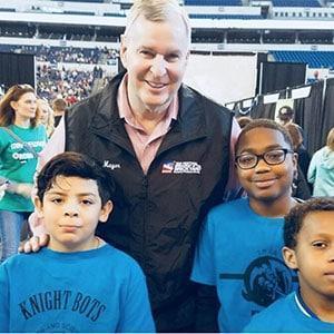 Students showing their science fair certificates
