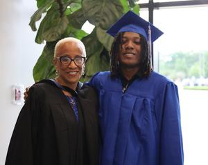 Holloway High School Principal Sumatra Drayton and student at 2025 graduation ceremony.