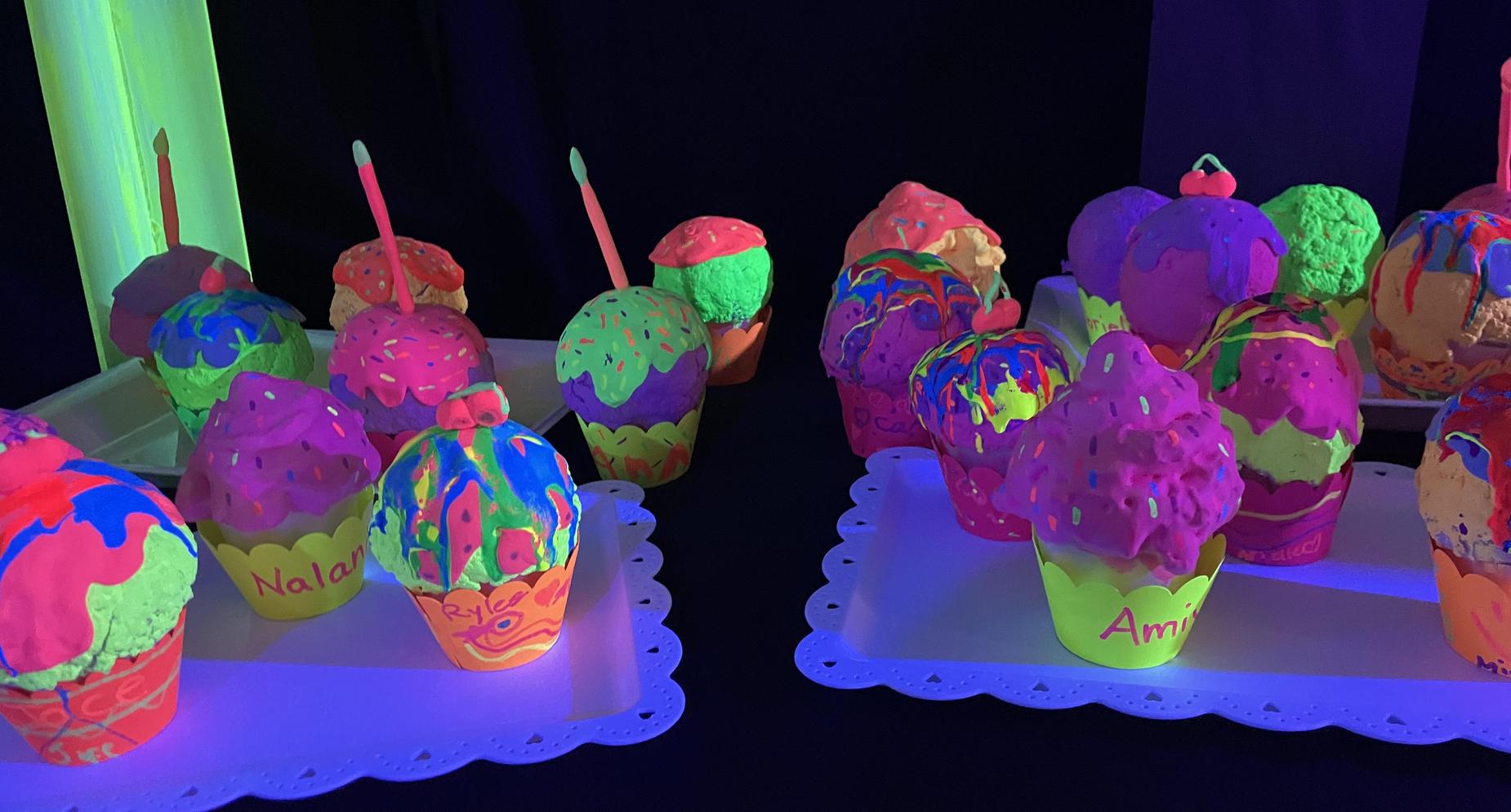 Student neon artwork of cupcakes