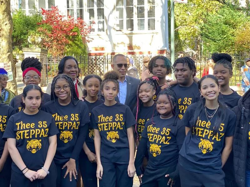 Students collaborating on building a paper tower