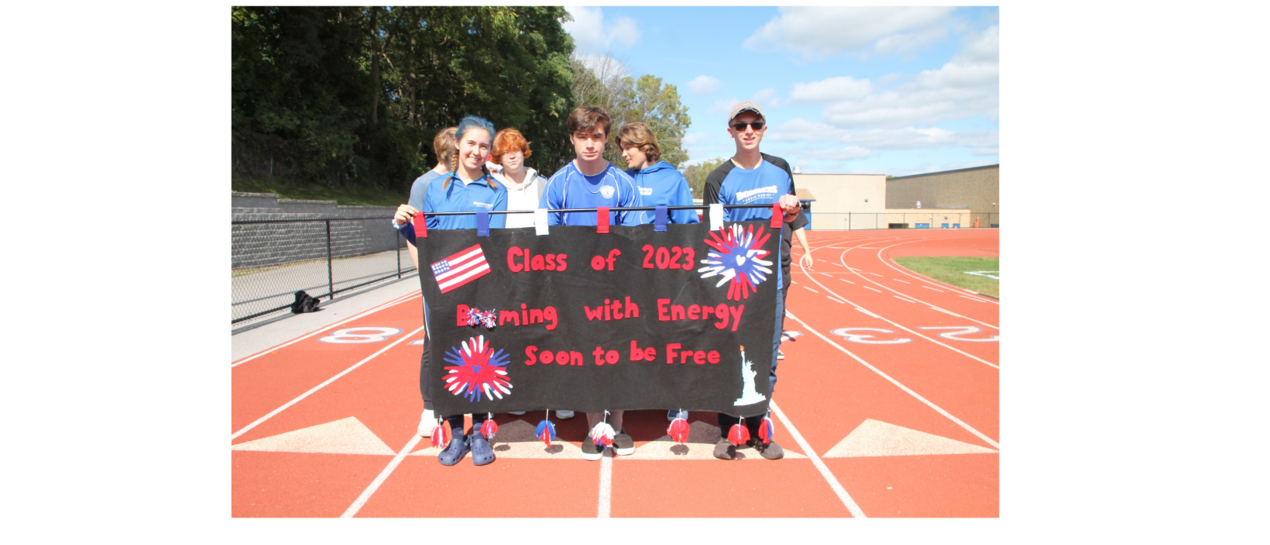 students carrying a banner