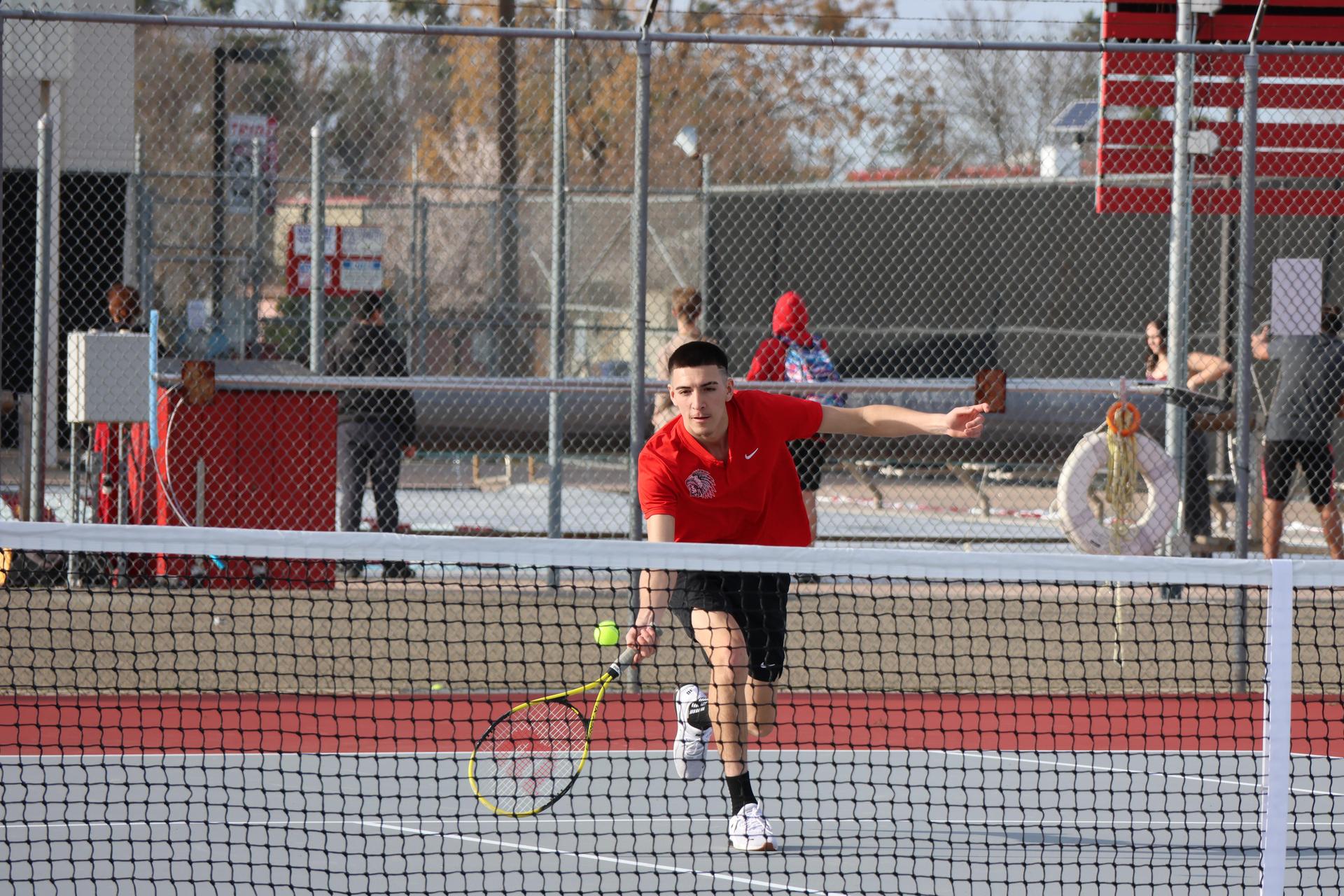 CUHS Boys playing tennis against coalinga