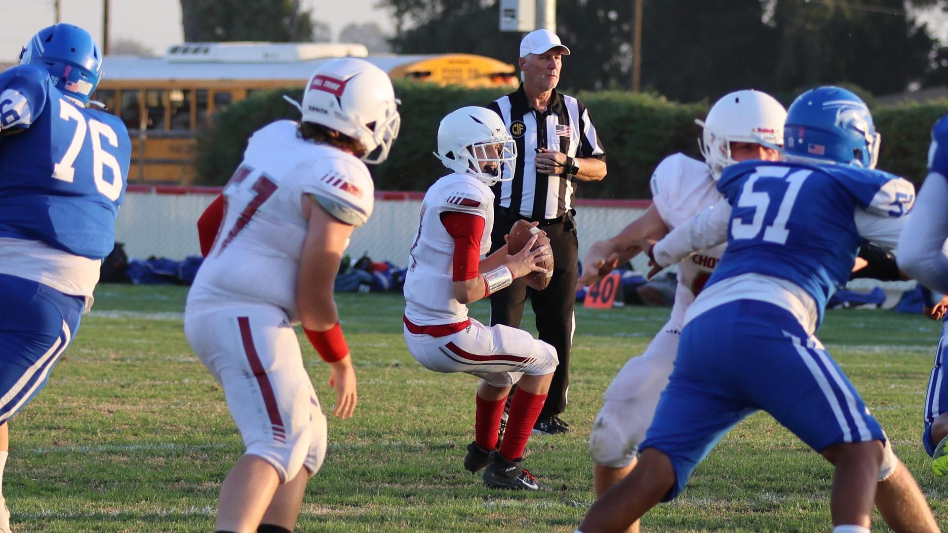 Junior Varsity football players in action against Caruthers