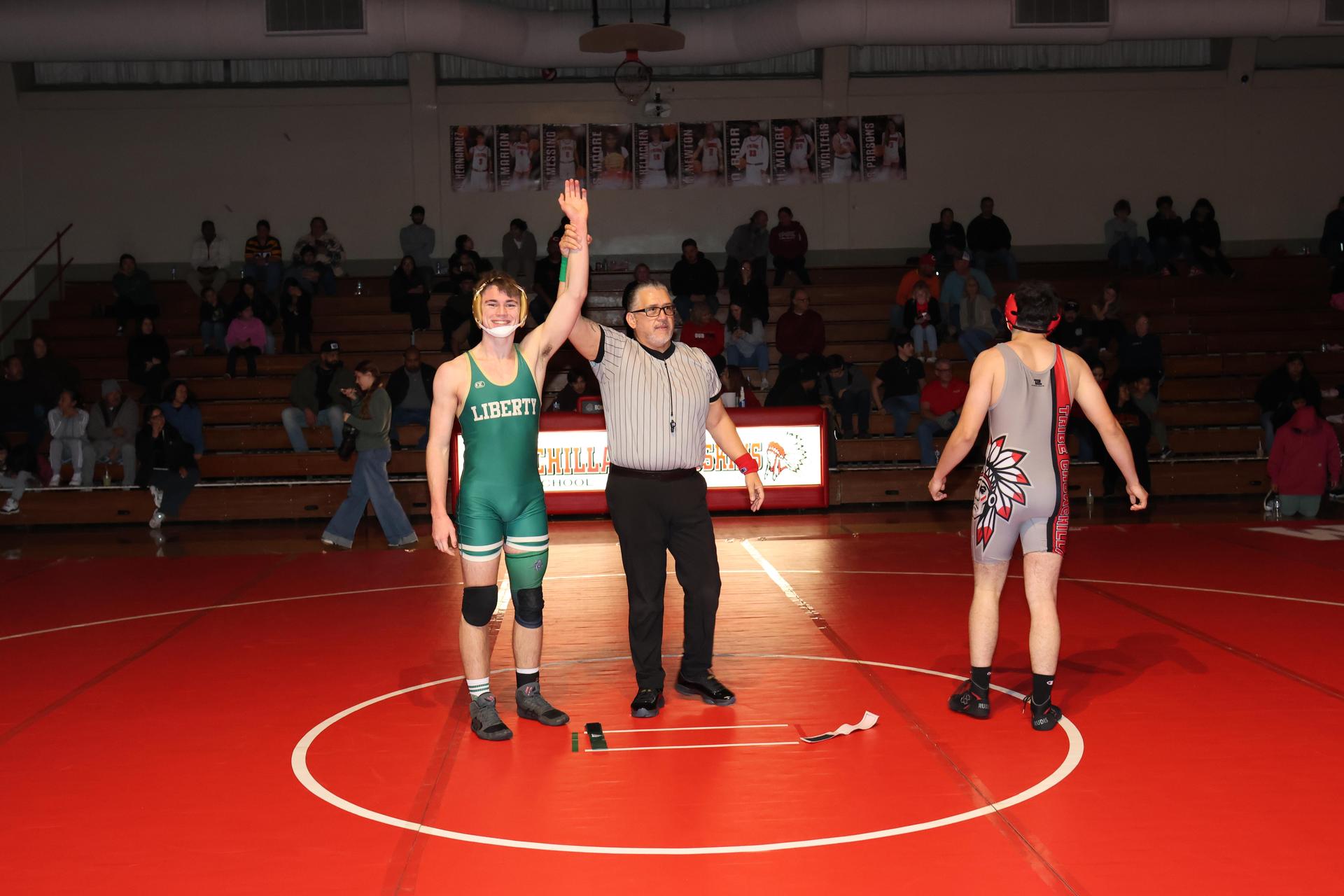 Wrestling winners with hands up 127