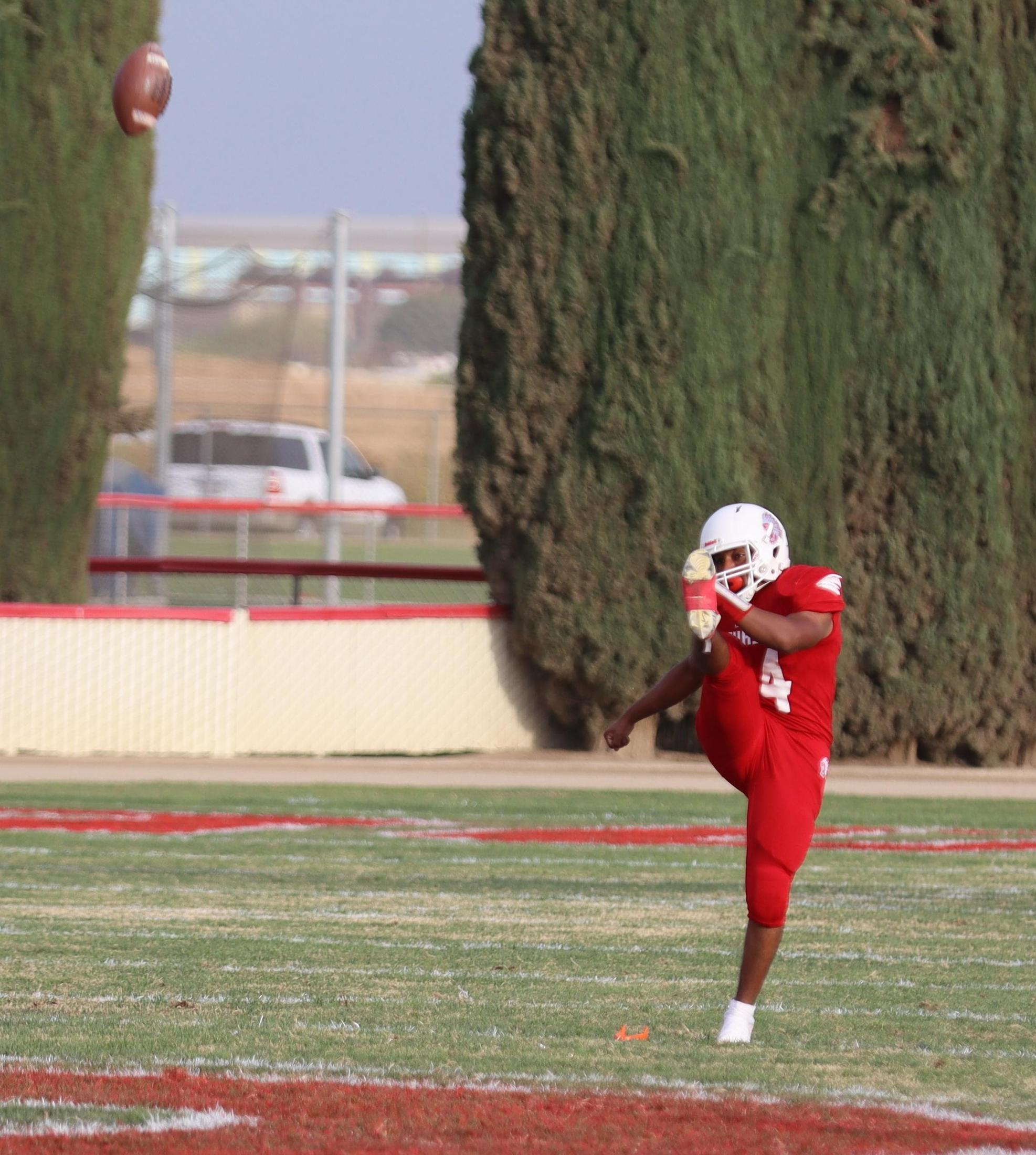 junior varsity football players in action against riverdale