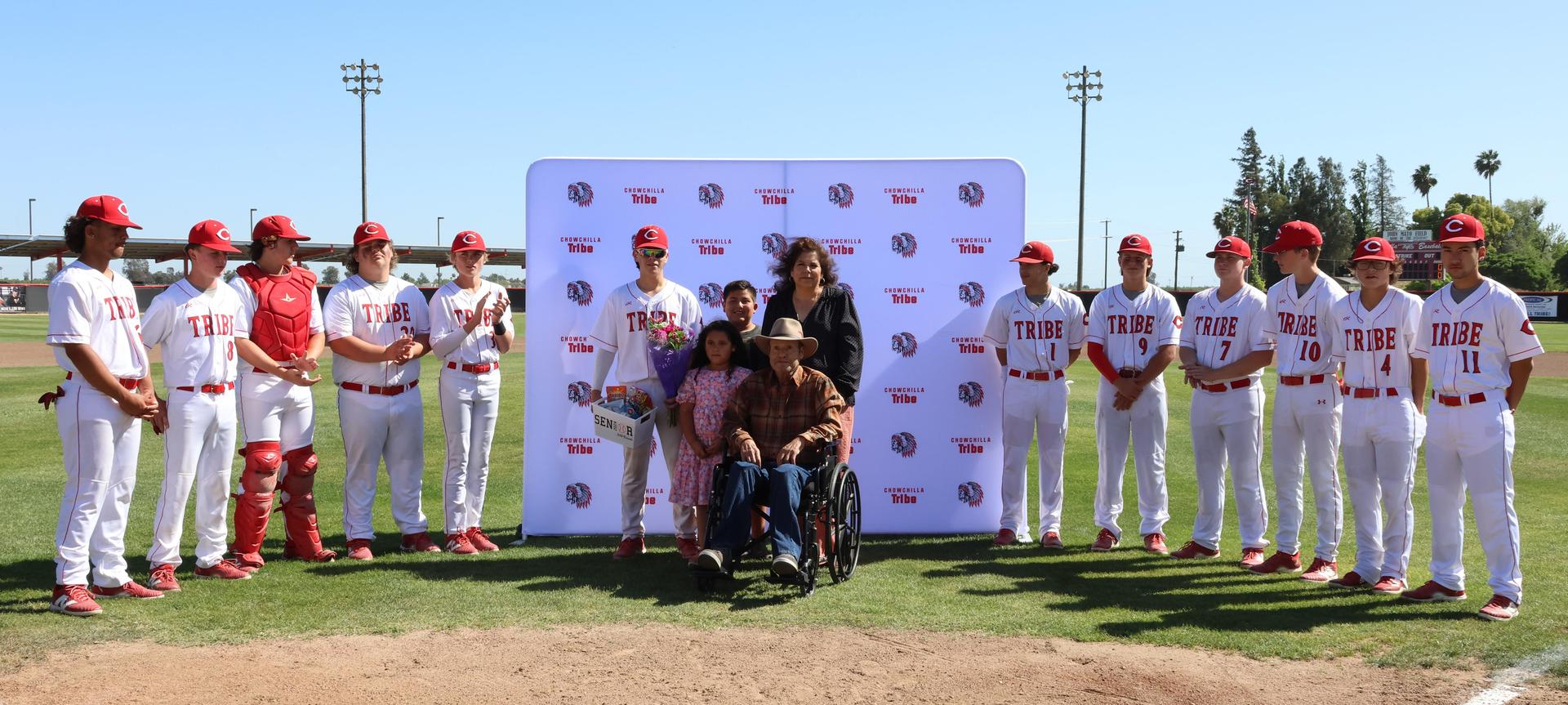 Seniors Posing With Teammates, Coaches, And Family