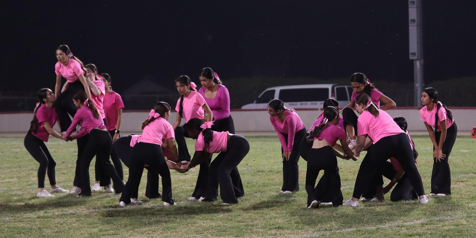 Varsity Cheer performing at halftime vs. Fowler