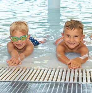 Two boys in shallow end of pool