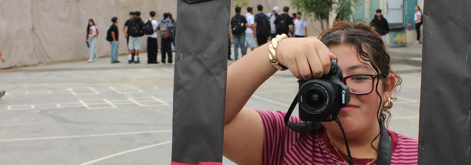 Student with camera