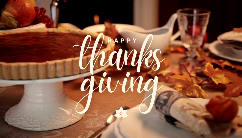 Happy Thanksgiving with a feast in the background