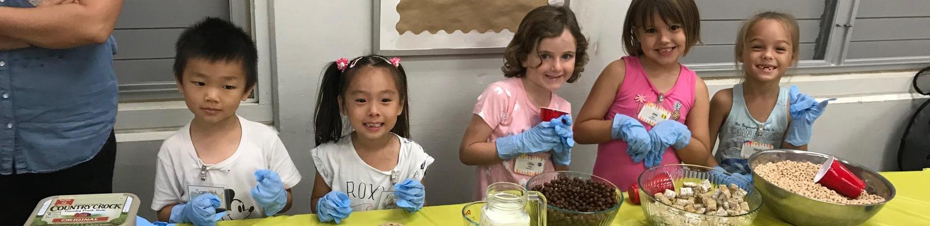 5 kindergarten students serving at the first responders breakfast