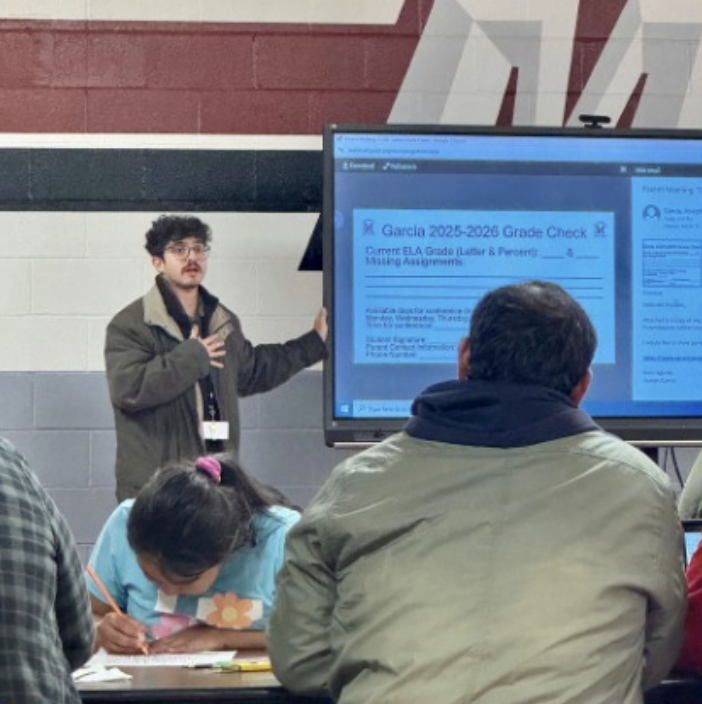 Parents at workshop looking at screen